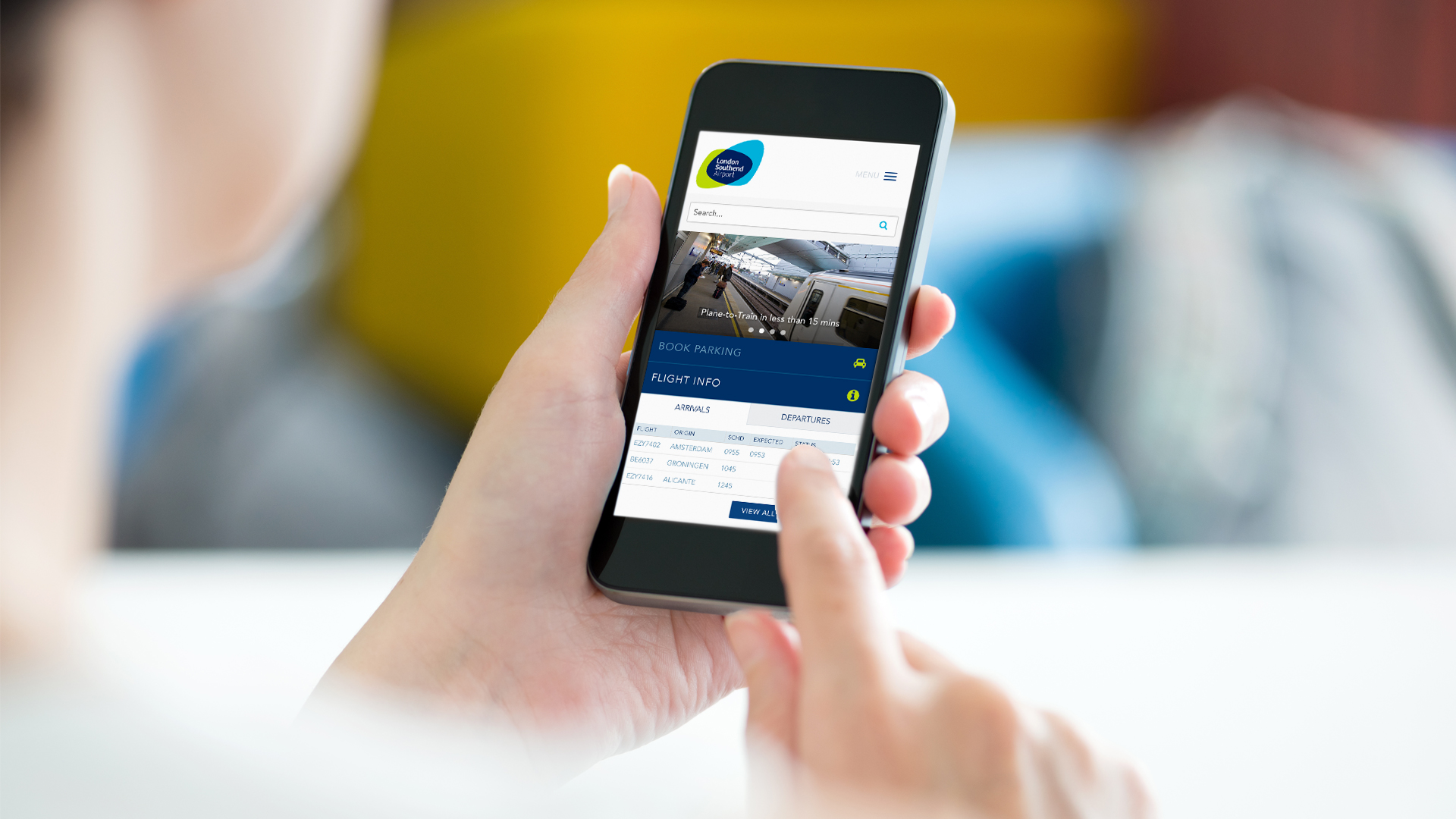 Image showcasing a user navigating the london southend airport website via their mobile.